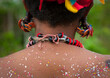 © Eric Lafforgue - Tribal woman with poillen on her back, Milne Bay Province, Trobriand Island, Papua New Guinea