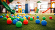 © fia - Colorful ball pit and slide in indoor playground for children's fun and activity