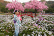 © geargodz - woman and child girl in yukata (kimono dress) with sakura flower or cherry blossom blooming in garden