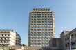 © Travel 'n' Lifestyle - View of the towering concrete building rises against the clear blue sky, its repetitive window pattern creating a stark architectural statement, Oslo, Oslo, Norway.