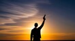 © Vidya Rahmandari - Silhouette of a person holding an object against a sunset
