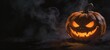 © W.O.W - Spooky glowing jack-o-lantern in dark smoke. Carved pumpkin with evil face for Halloween party. Scary vegetable lantern with fire inside as symbol of horror and autumn celebration.