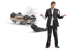 © Ljupco Smokovski - Man in a ripped suit and an overturned damaged car after an accident