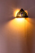 © vvoe - retro arabic wall light on peach painted wall