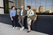 © ADDICTIVE STOCK - Businessmen chatting in urban setting