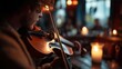 © M.Gierczyk - Fiddle bow in candlelight with wooden interior and flame glow