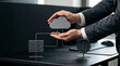 © Imran - Businessman managing cloud data storage in modern office