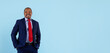 © Anastasiya - Smiling mature african american businessman standing in blue suit on studio background. Professional corporate portrait of confident male leader representing success and business lifestyle