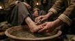 © GS-Studio - A person's feet being washed by another person's hands in a basin filled with water. The scene is illuminated by candlelight, suggesting a moment of solemn intimacy.