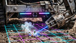 © Arkadiusz - Autonomous agricultural robot using a precise blue laser to destroy weeds on a neon data grid