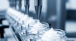 © cllareta - Automated cream dispensing line filling small jars, captured in a cool, blue-toned environment