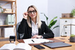 © New Africa - Portrait of notary at wooden desk in office