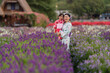 © geargodz - woman and child girl in yukata (kimono dress) with flower blooming in garden