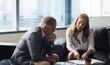 © peopleimages.com - Document, review and business people in office with discussion, manager advice and court case report. Lawyers, meeting and check paperwork in firm with management opinion, law compliance or teamwork.