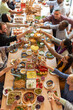 © Rawpixel.com - Diverse group sharing meal joyfully.