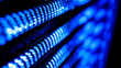 © Alpaca - rack. Close-up of glowing blue server rack lights creating an abstract technological pattern on a dark background. product launch decks.