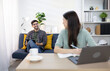 © Aphisara - Smiling couple sharing coffee at home during work or study, cozy modern home office setting, warm interaction and a relaxing break, lifestyle and relationship moment.
