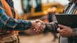 © TetyanaK - Man, engineers with tablet computer, shaking hands at sand quarry of ore mine. Banner, bokeh. Close-up.