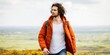 © Rawpixel.com - Man in orange jacket walking outdoors. Casual attire with orange jacket. Scenic background with man in orange jacket. Outdoor adventure with orange jacket. Man hiking in British nature.