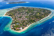 © whitcomberd - Aerial view of Gili Air island in Indonesia featuring beaches, reefs, and local village
