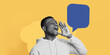 © Prostock-studio - A man shouts loudly while standing against a yellow background. He is wearing a white hoodie. A speech bubble appears next to him. This collage shows his expression of excitement or engagement.