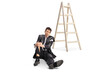 © Ljupco Smokovski - Injured businessman in a torn suit sitting on the floor next to a wooden ladder