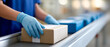 © perfectlab - Worker handling packages on conveyor belt