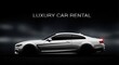 © Ariestia - Sleek white luxury coupe displayed in profile against a dark, atmospheric background for a vehicle hire advertisement.