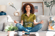 © nenetus - Relaxing mature woman doing yoga exercises on the couch at home