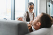 © Serhii - Woman psychotherapist counseling man patient during therapy session
