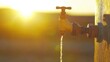 © Syazana - Dripping Water Tap in Arid Landscape at Sunset Symbolizing Water Scarcity and Conservation Needs