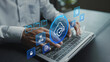 © Pakin - Cloud security and data protection concept. Person using laptop with cloud computing and cybersecurity icons, secure data storage, privacy protection and digital infrastructure.