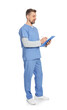 © New Africa - Medical worker in blue uniform with clipboard on white background