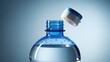 © MuhammadFurqan - Refreshing clear pure drinking water in an open plastic bottle with blue cap and droplets