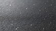 © William - Black asphalt road texture with small stones closeup view of rough surface ideal for construction design or abstract background high detail realistic urban industrial texture macro