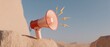 © Ryzhkov - Pink megaphone with lightning bolts emitting from the speaker on sand rocks with copy space for digital marketing, social media promotion and business announcement