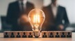 © Supernova - Innovative business concept with light bulb and wooden blocks
