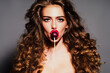 © Volodymyr - Lollipop sensual candy lover portrait. Sexy model. Beauty sensual woman. Lollipop playful sweet pop culture style. Lollipop colorful studio beauty concept. Lollipop young woman with candy.