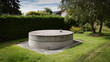 © A2Z AI  - Circular concrete plinth on gravel in a lush green garden with hedges, trees, and partial residential view under a bright summer sky