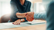 © peopleimages.com - Handshake, deal and business people in office with agreement, contract or finance partnership. Meeting, welcome and financial advisor shaking hands with investor for investment negotiation at agency.