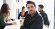 © peopleimages.com - Serious, professional and portrait of businessman in office for meeting with confidence for finance career. Collaboration, job and financial manager with pride for company about us in workplace.