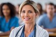 © Lubos Chlubny - Female doctor smiling in healthcare medical training class