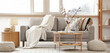 © Pixel-Shot - Interior of living room with grey sofa, table and cotton flowers in vase