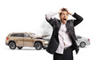 © Ljupco Smokovski - Shocked businessman screaming in front of crashed cars