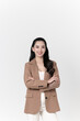 © Areerat - Happy young Asian businesswoman standing and crossed arms gesture isolated on white background.