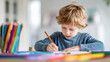 © Mrammon - Curly hair boy drawing child concentration colorful pencil creative activity homework art learning education home interior natural light Curly hair boy drawing table, child concentration with