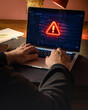 © Francisco - Red Warning Alert on Laptop Screen During Cyber Incident