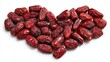 © Udan - Many dried pitted fruits are artfully arranged into a heart shape on a white background.