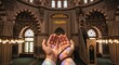 © soem - A person with outstretched hands is in a posture of prayer within a grand mosque. The individual is wearing a bracelet and appears to be deeply focused on their devotion.