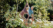 © peopleimages.com - Yoga, stretching and senior couple in backyard, holistic exercise and morning routine for body wellness. Active, pilates and elderly people with warrior pose in garden, balance and retirement health